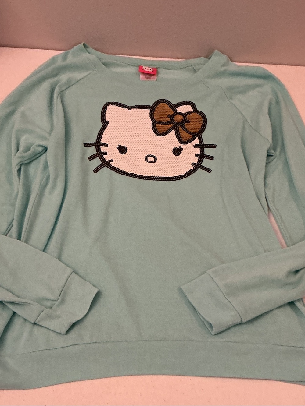 Hello Kitty Mint Green Long-Sleeve Lightweight Sweatshirt with Sequin Face